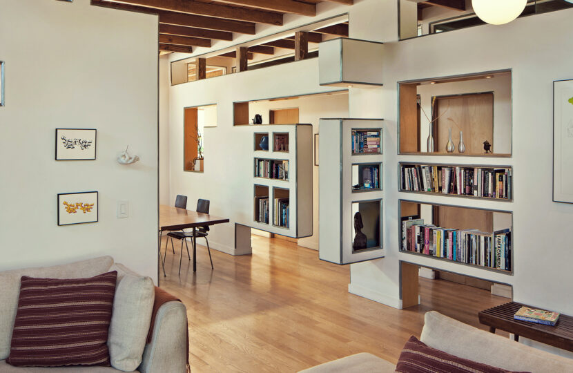 Cozy living room with built-in bookshelves and wooden accents.